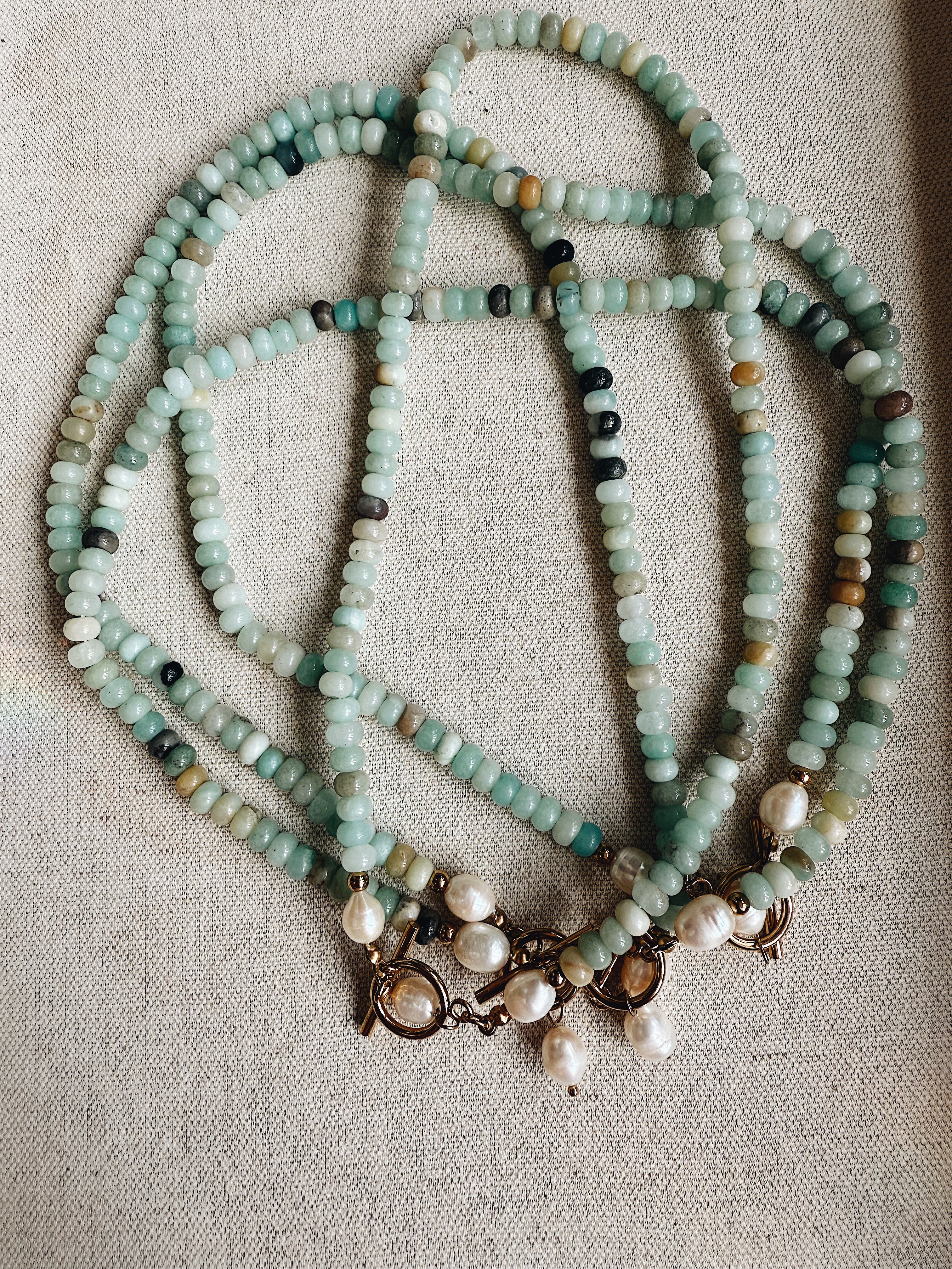 The Bonnie Necklace – freshwater pearl and crystal beaded layering necklace in amazonite, peach aventurine, sunstone, blue jasper, and apatite
