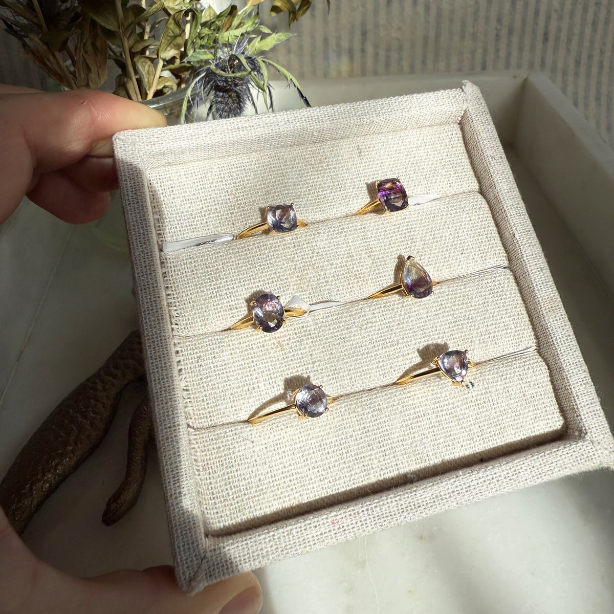 Faceted Rainbow Fluorite Rings by Wild Alabaster — hand-cut fluorite gemstone rings with natural bands of green, violet and blue on gold settings.