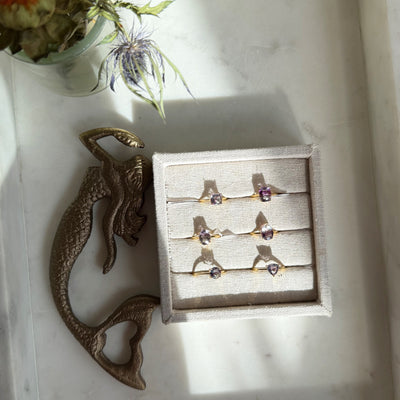 Faceted Rainbow Fluorite Rings by Wild Alabaster — hand-cut fluorite gemstone rings with natural bands of green, violet and blue on gold settings.